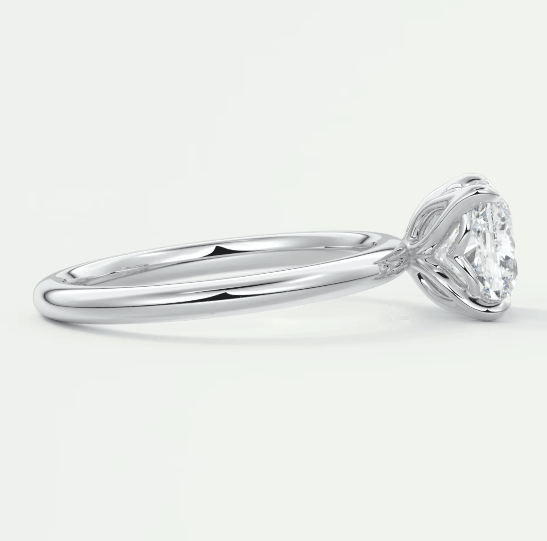 18-karat white gold engagement ring with a round diamond.
