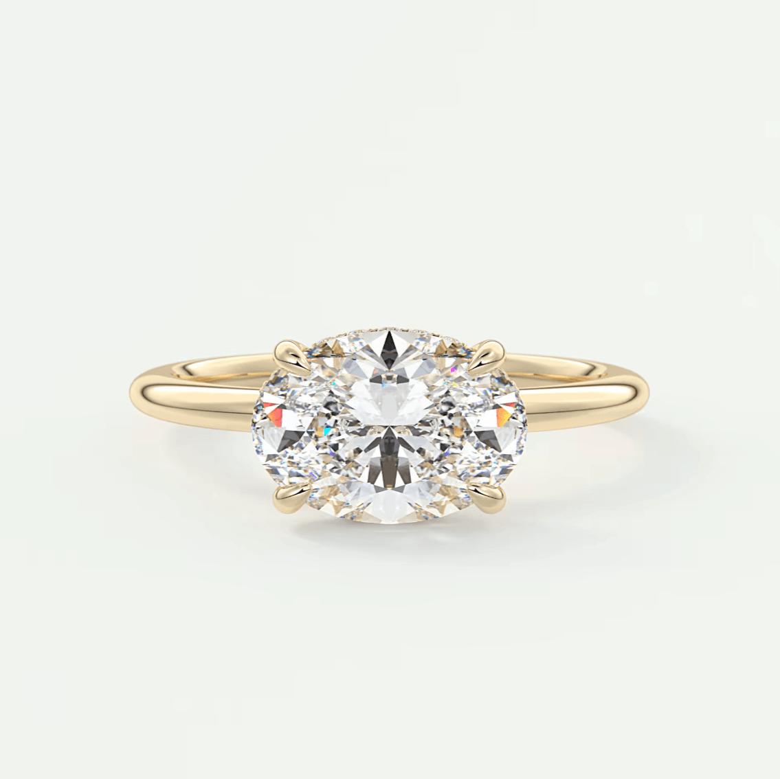 18k yellow gold diamond engagement ring with a round brilliant cut gem.