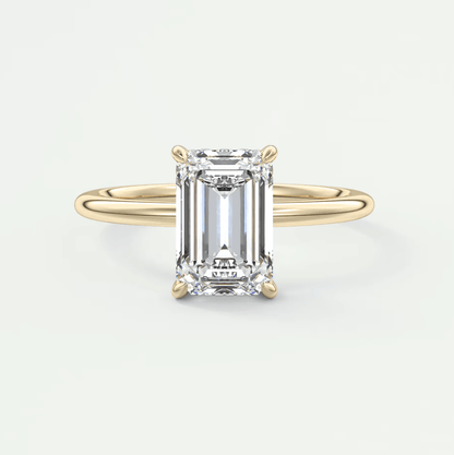 18k yellow gold emerald-cut diamond engagement ring.