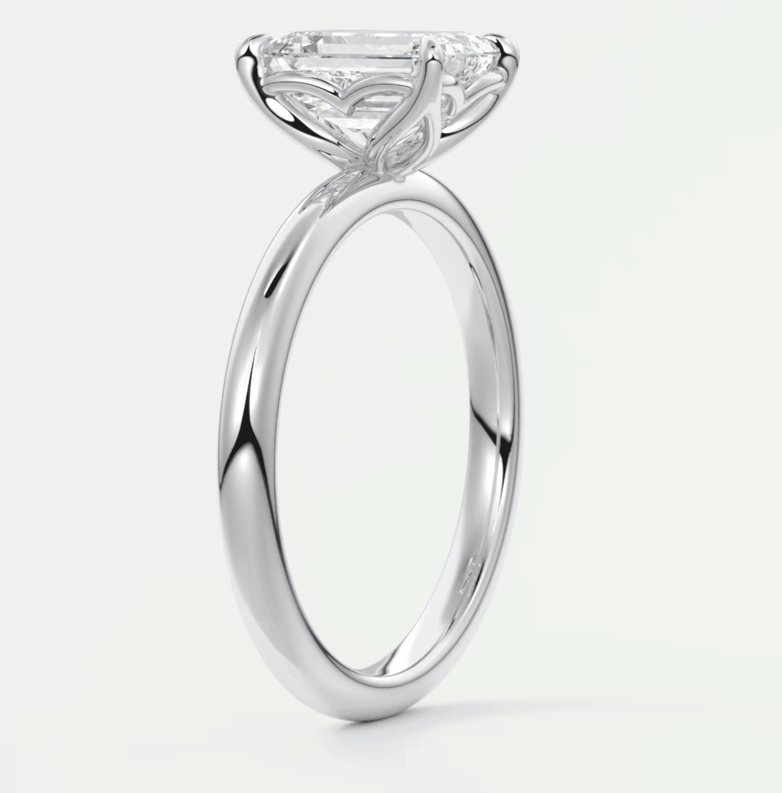 18-karat white gold engagement ring with a marquise-cut diamond.