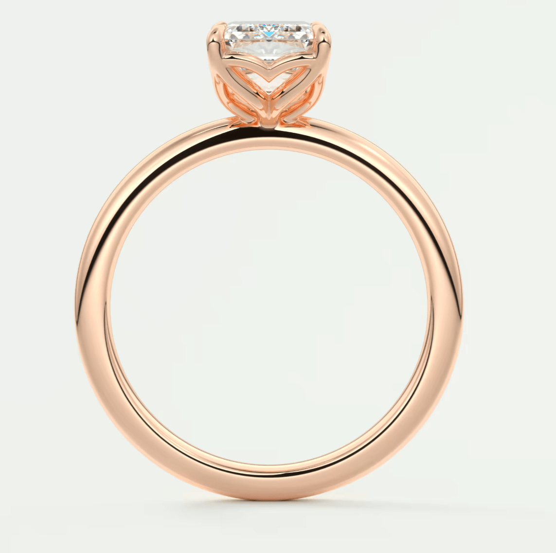 18-karat rose gold engagement ring with a princess-cut diamond.