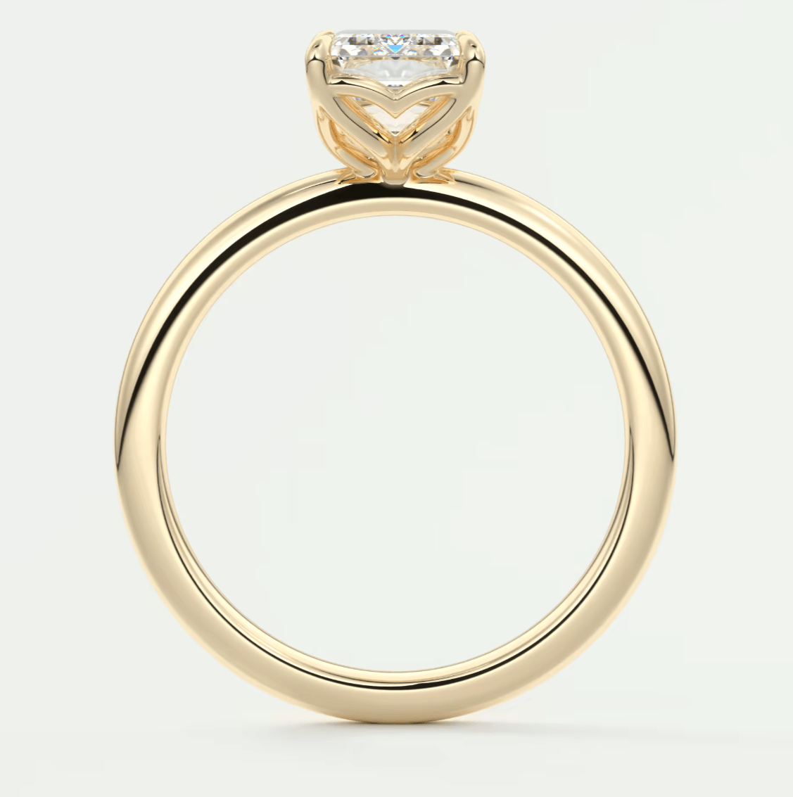 18k yellow gold engagement ring with a princess cut diamond.