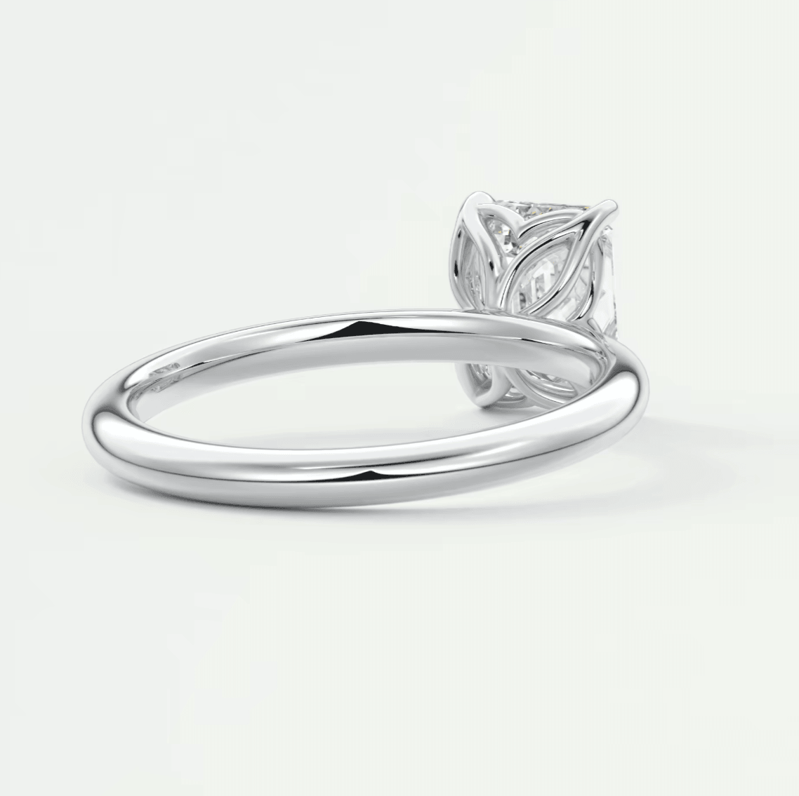 Silver leaf design engagement ring with diamond center stone.