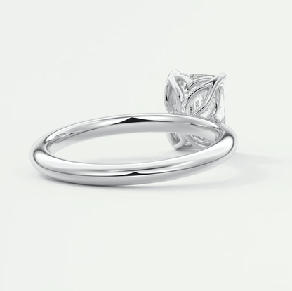 Silver leaf design engagement ring with diamond center stone.