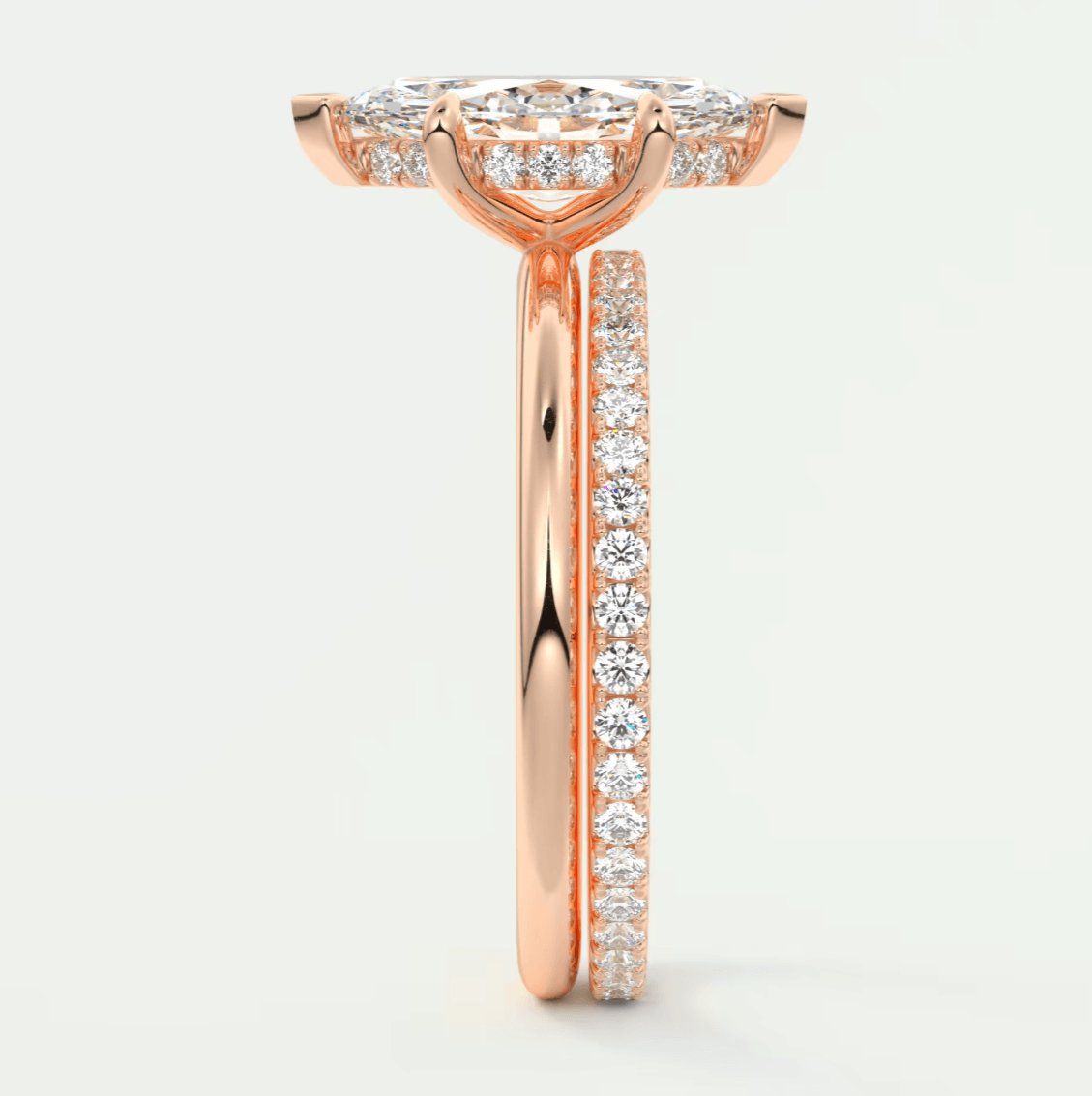 18-karat rose gold diamond engagement ring with a halo design.