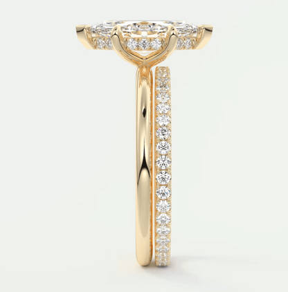 18k yellow gold diamond engagement ring with a princess cut center stone and channel set diamonds on the band.