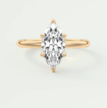 18k yellow gold marquise diamond engagement ring with a solitaire design.