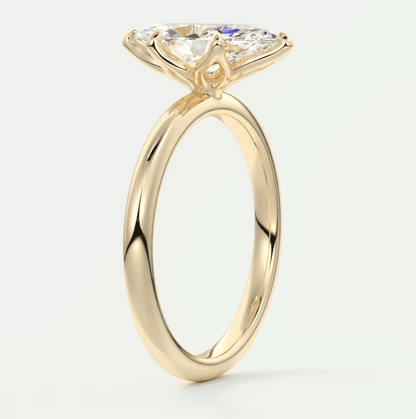 18k yellow gold solitaire engagement ring with a marquise-cut diamond.