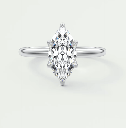 Marquise-cut diamond engagement ring with white gold band, featuring a central stone and intricate prong setting.