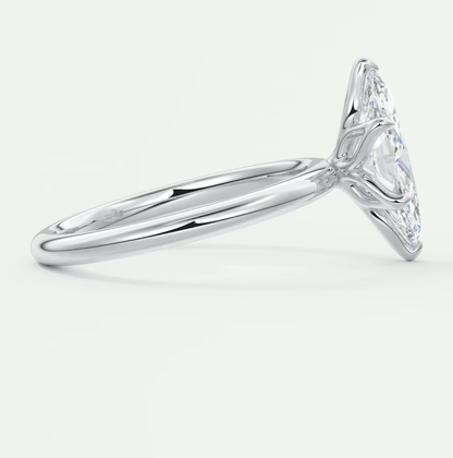 18k white gold engagement ring with a marquise-cut diamond.