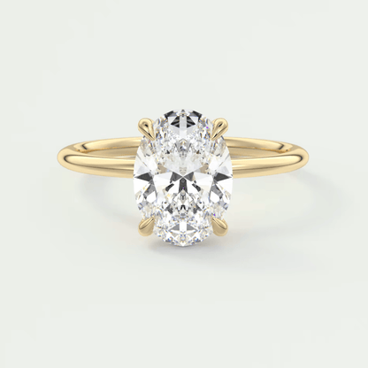 18k yellow gold oval diamond engagement ring with a solitaire design.
