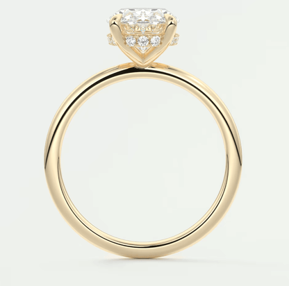 18-karat yellow gold engagement ring with a princess-cut diamond center stone and small pavé diamonds on the band.