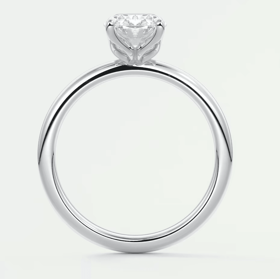 18-karat white gold engagement ring with a heart-shaped diamond.