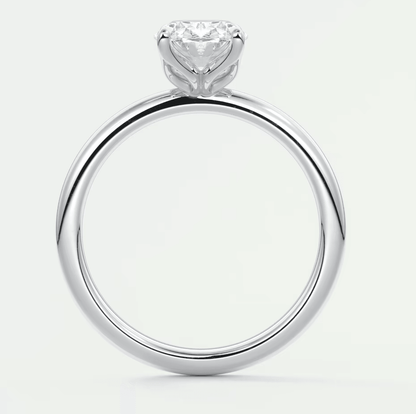 18-karat white gold engagement ring with a heart-shaped diamond.