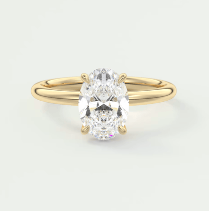 18k yellow gold oval diamond engagement ring with a solitaire setting.