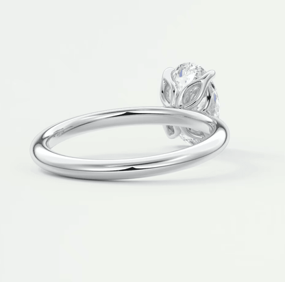 Silver owl ring with diamond eyes and beak, crafted from sterling silver.