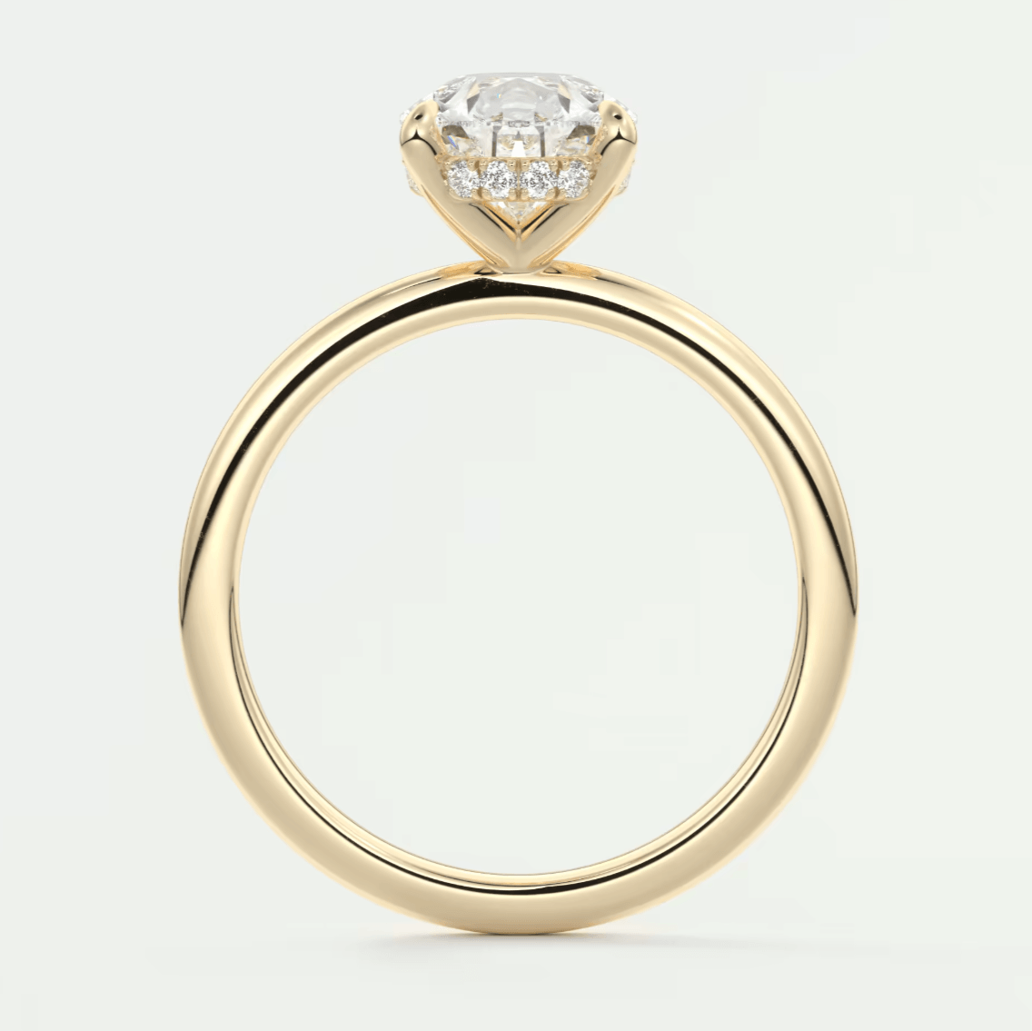 18k yellow gold solitaire diamond engagement ring with a round brilliant cut stone.