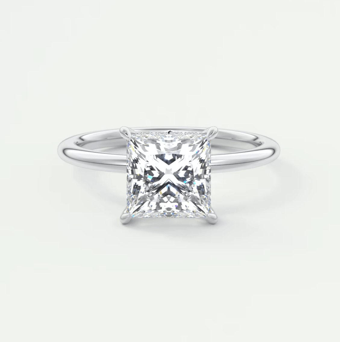 Princess cut diamond engagement ring with white gold band.