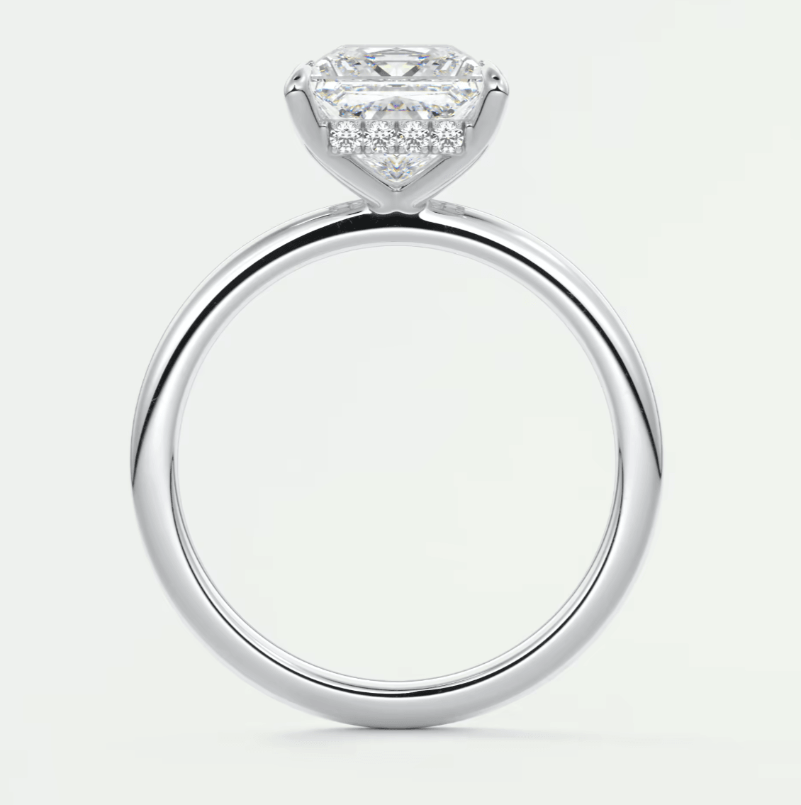 18k white gold engagement ring with a princess cut diamond and halo design.