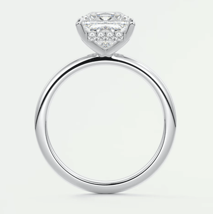 18k white gold engagement ring with a princess cut diamond and halo design.