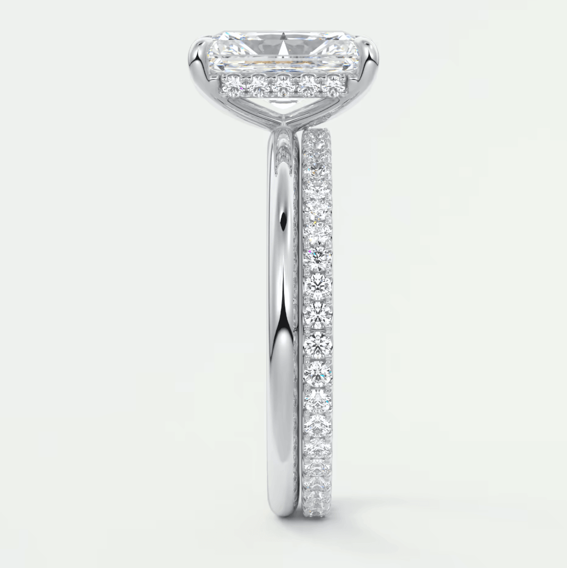 18k white gold princess cut diamond engagement ring with a pave band.
