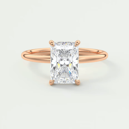 18-karat rose gold engagement ring with a radiant cut diamond.