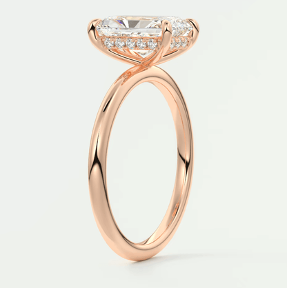 18k rose gold engagement ring with princess cut diamond and halo design.