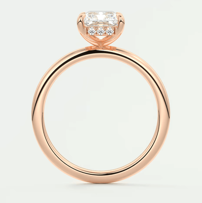Rose gold diamond engagement ring with a princess cut center stone and small diamonds on the band.