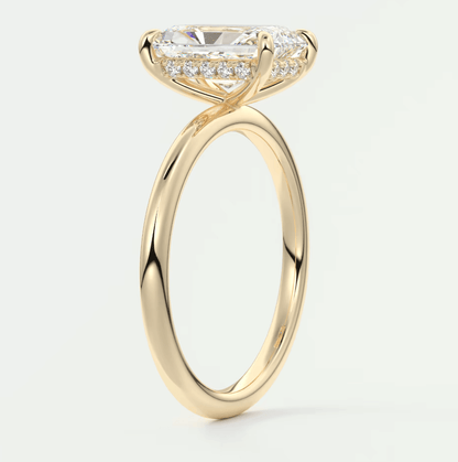18k yellow gold engagement ring with a princess cut diamond and halo of smaller diamonds.