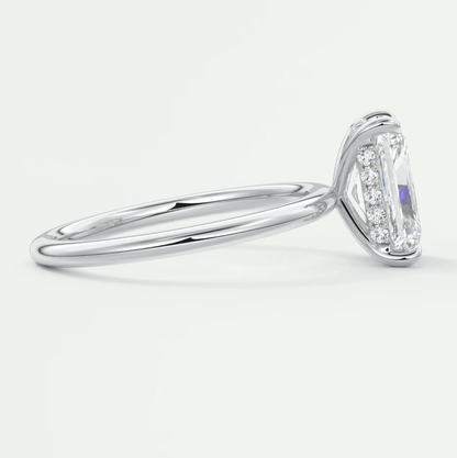 18k white gold diamond engagement ring with an emerald-cut center stone and halo of smaller diamonds.