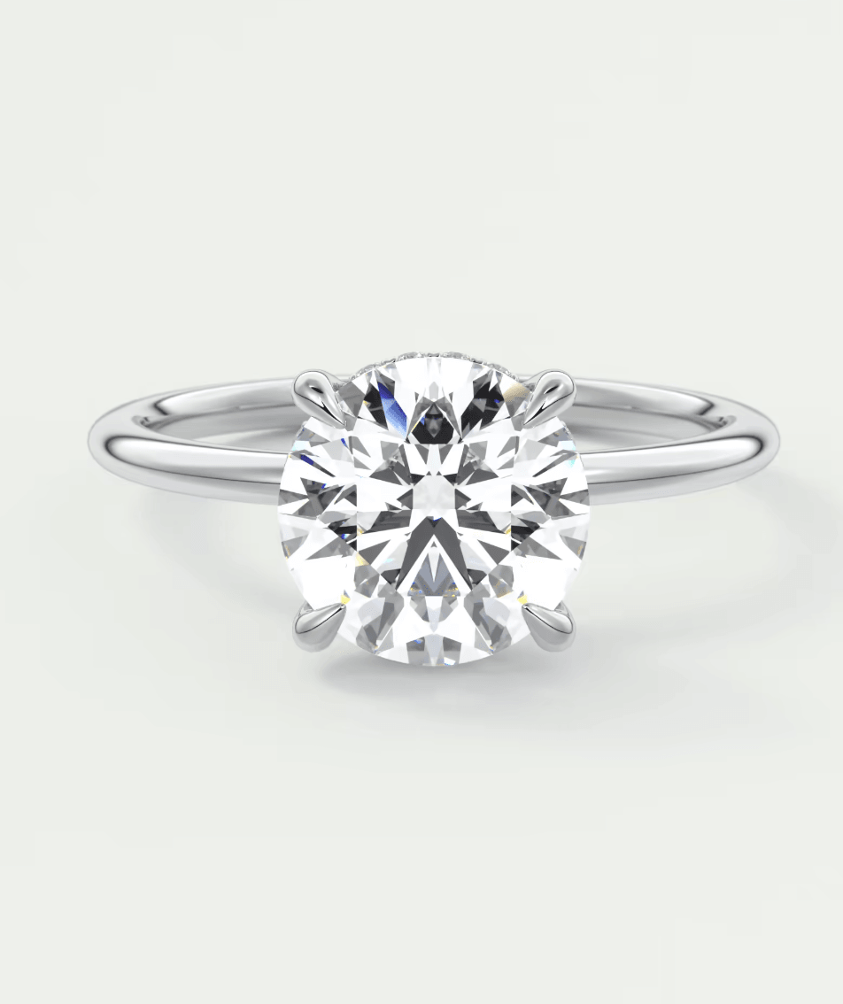 Diamond solitaire engagement ring with a round brilliant cut stone set in white gold.