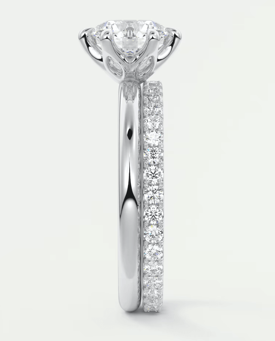 18k white gold diamond engagement ring with intricate floral design.