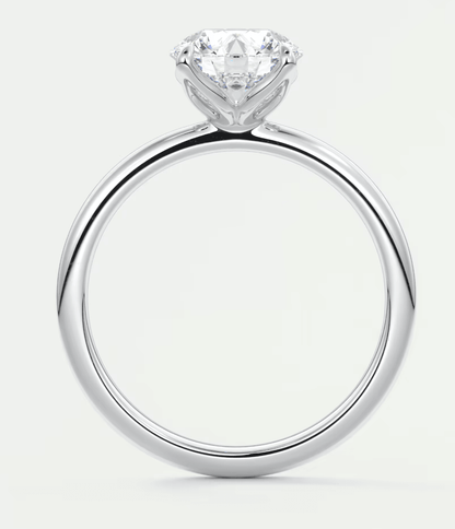 18k white gold engagement ring with a princess cut diamond.