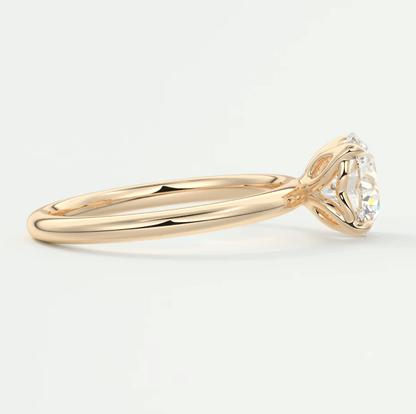 18k yellow gold solitaire diamond engagement ring with a round brilliant cut stone.