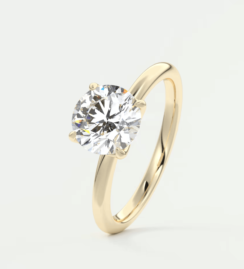 18k yellow gold solitaire diamond engagement ring.