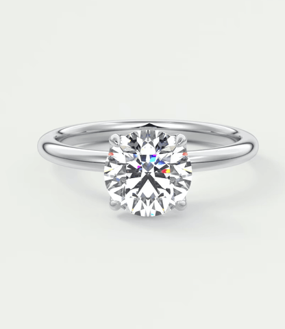 18-karat white gold solitaire diamond engagement ring with a round brilliant cut.