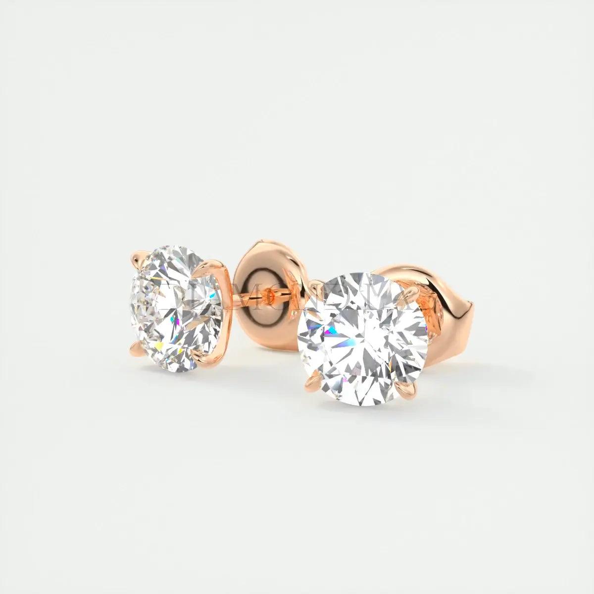 14k rose gold diamond stud earrings.