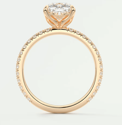 18k rose gold engagement ring with a princess-cut diamond and pavé set diamonds on the band.
