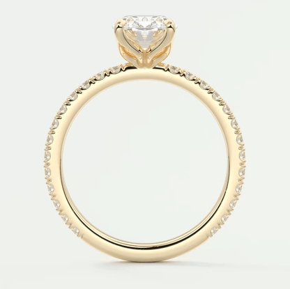 18k yellow gold engagement ring with a princess cut diamond and pavé set diamonds on the band.
