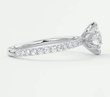 18k white gold diamond engagement ring with a round brilliant cut center stone and pave set diamonds on the band.