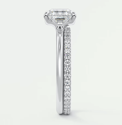 18k white gold engagement ring with a princess cut diamond and pave set diamonds on the band.