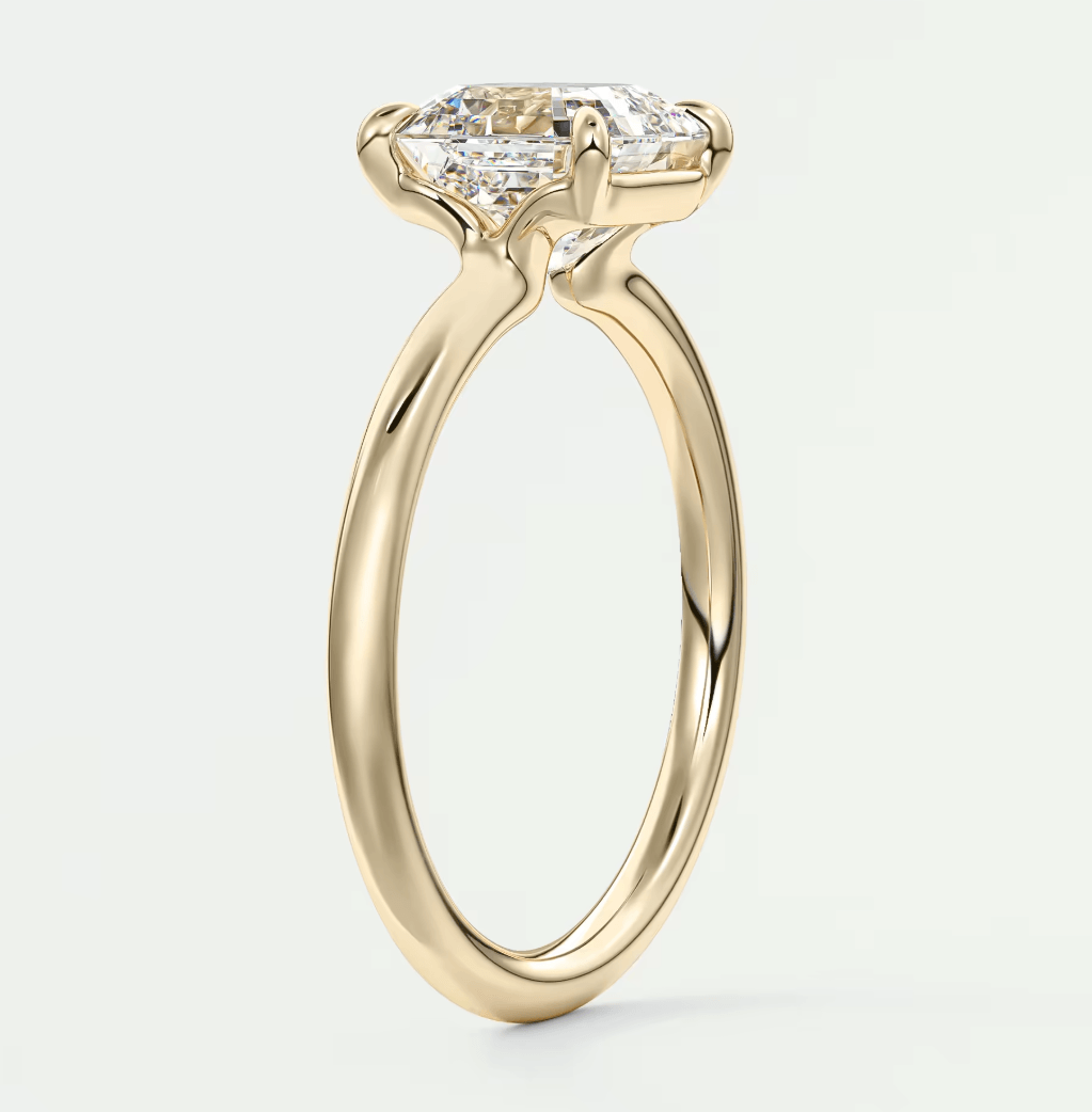 18-karat yellow gold engagement ring with a princess-cut diamond.