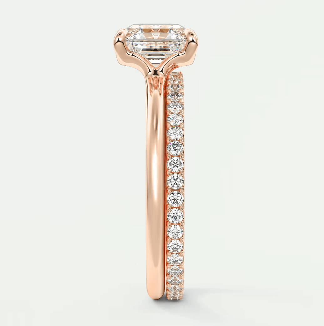 18-karat rose gold engagement ring with a princess-cut diamond and pave-set diamonds on the band.
