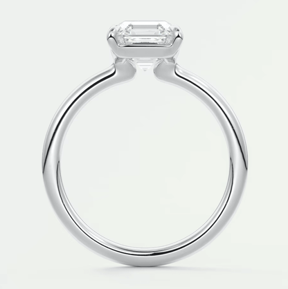 18k white gold emerald cut diamond engagement ring with a sleek, modern design.