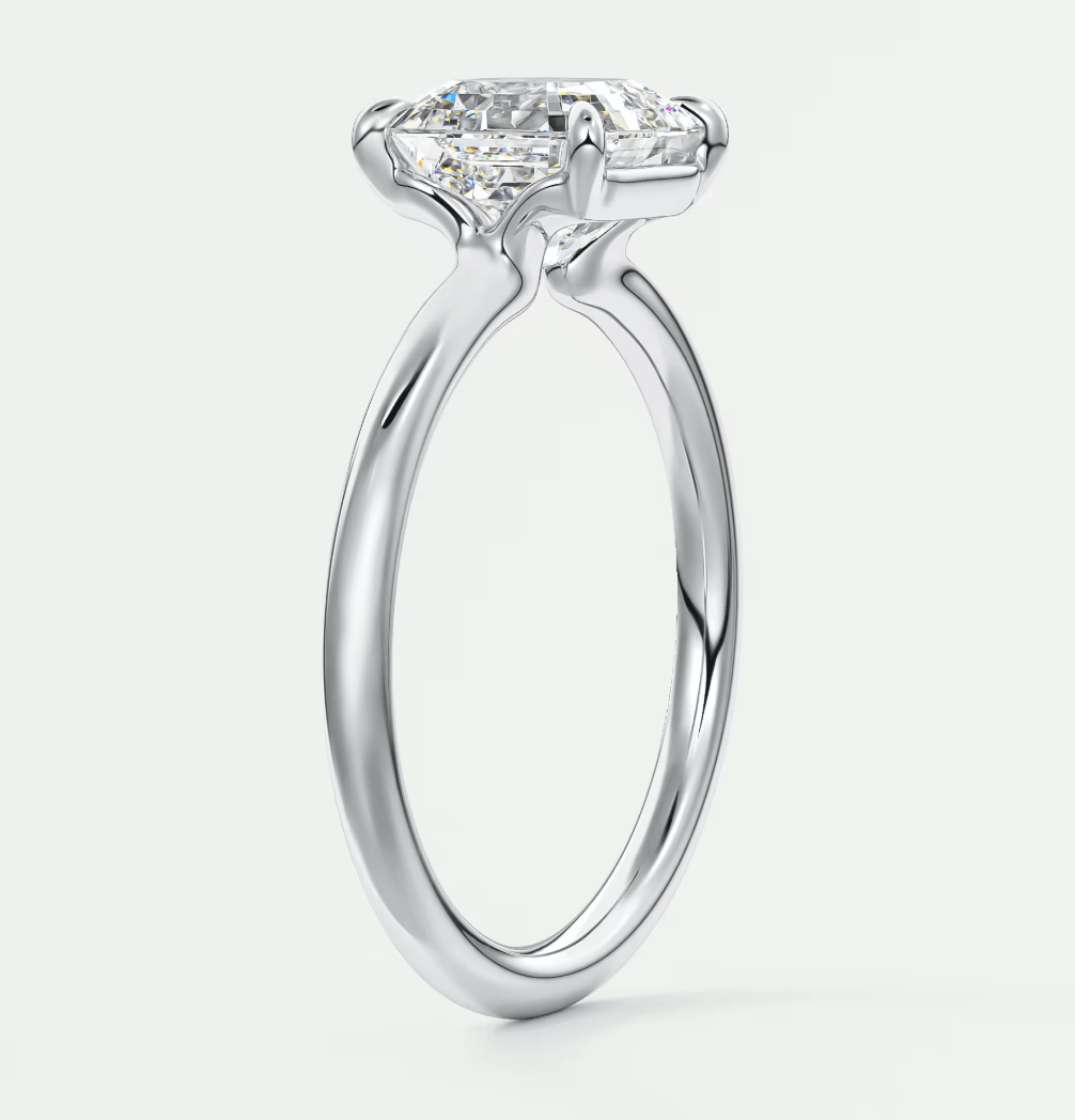 18-karat white gold engagement ring with a princess-cut diamond.