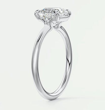18-karat white gold engagement ring with a princess-cut diamond.