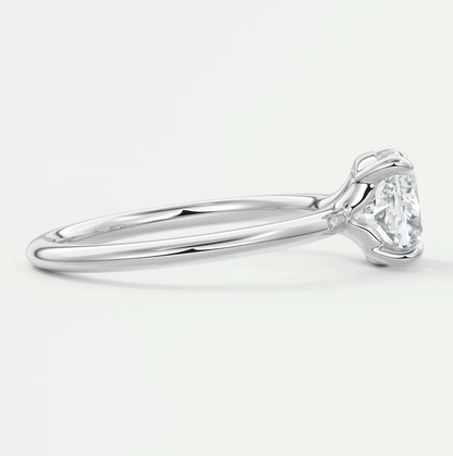 18-karat white gold solitaire diamond engagement ring.