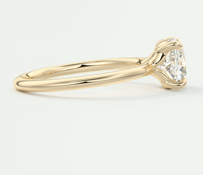 18k yellow gold engagement ring with a marquise-cut diamond.