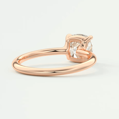 Rose gold engagement ring with a cushion-cut diamond.