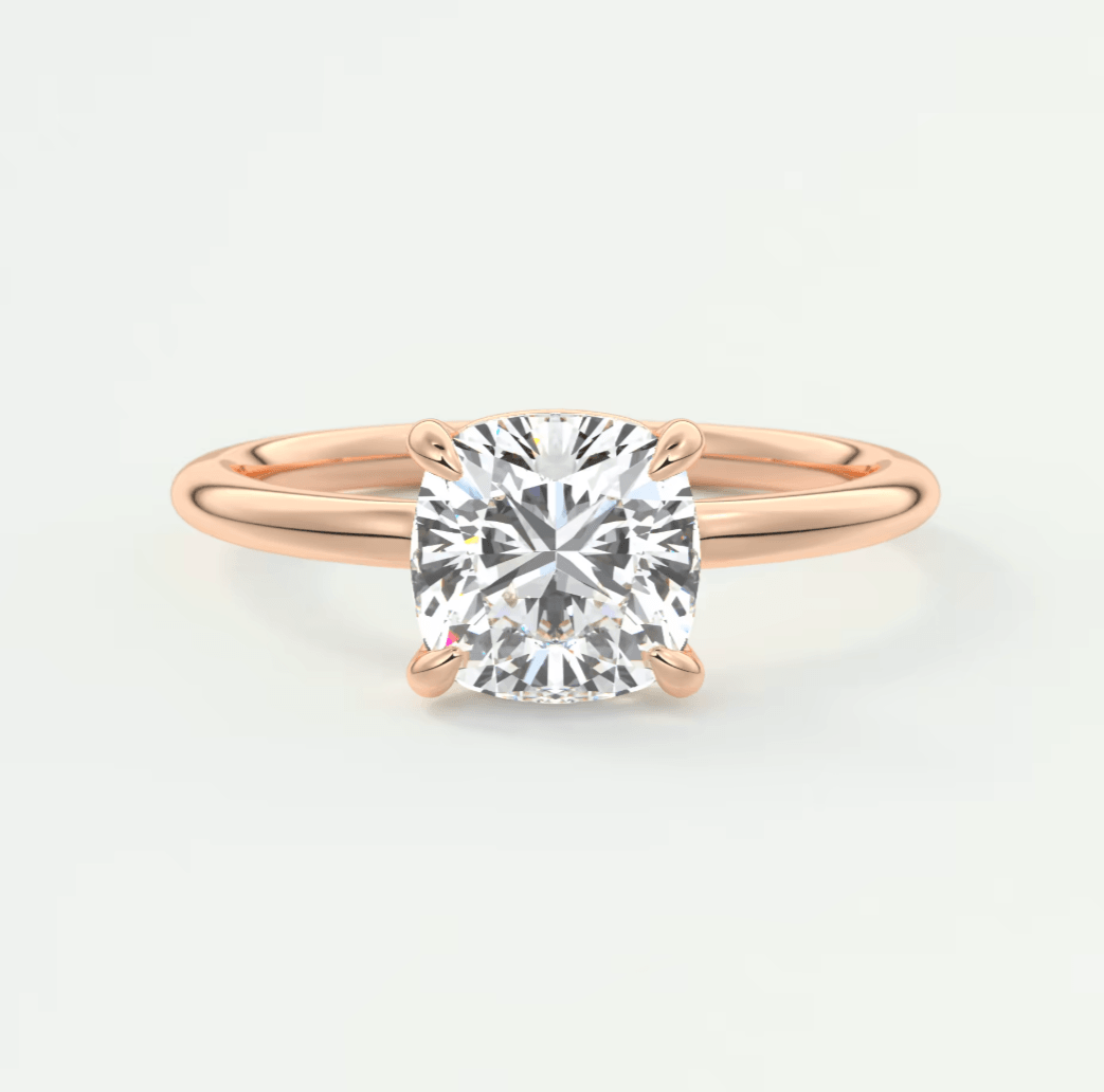 Rose gold diamond engagement ring with a cushion-cut stone.